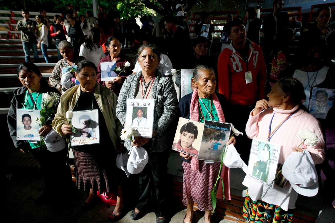 Members of the Central American Mothers Caravan with photos of their missing relatives, Guadalajara, Mexico