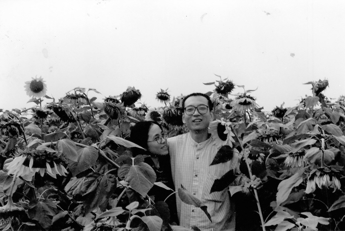 Liu Xiaobo with his wife Liu Xia surrounded by sunflowers