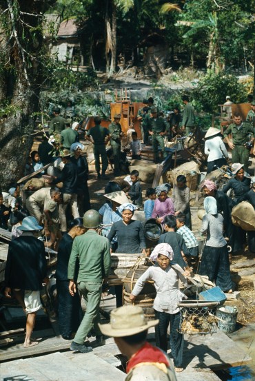 Vietnamese refugees preparing to evacuate the village of Ben Suc during an American raid, 1967